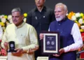PM releases a specially designed commemorative postage stamp and coin during the centenary celebrations of the Rashtriya Swayamsevak Sangh (RSS) at Ambedkar International Centre, in New Delhi on October 01, 2025.