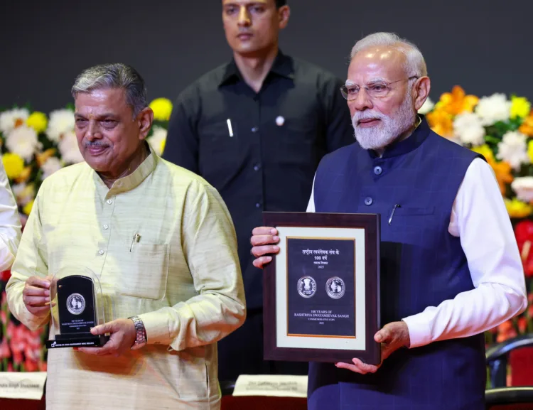 PM releases a specially designed commemorative postage stamp and coin during the centenary celebrations of the Rashtriya Swayamsevak Sangh (RSS) at Ambedkar International Centre, in New Delhi on October 01, 2025.